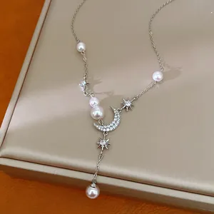 Exquisite detail view of star and moon necklace with zircon crescent pendant and white pearls