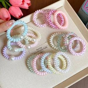Bunte Spiral-Haargummis im Dopamin-Stil mit Pastellmustern und eleganten Perlen-Akzenten