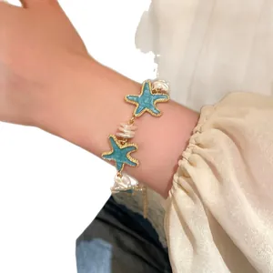 Elegant mint green starfish bracelet featuring white pearls for beach vacation style