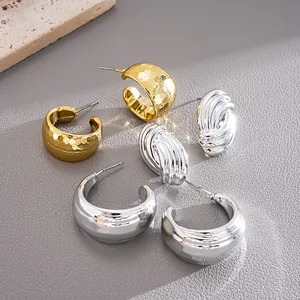 Close-up view of 6-piece C-shaped geometric earrings set in gold and silver finishes