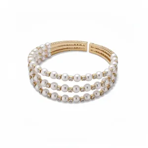 Elegant three-row pearl and crystal open cuff bracelet with gold-tone finish for women