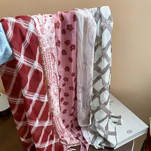 Collection of vintage floral and plaid chiffon scarves for women in assorted colors and patterns