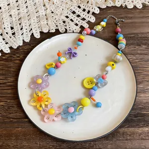 Detailed view of handmade dopamine style necklace with colorful acrylic beads and flowers