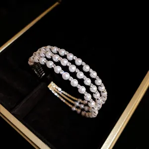 Elegant multi-layer pearl and rhinestone open cuff bracelet presented in a black jewelry box