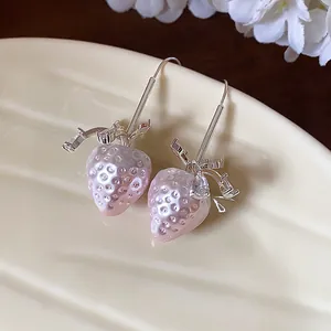 Exquisite close-up of pink pearl strawberry drop earrings with sparkling zircon droplets