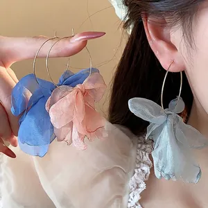 Elegant sweet holiday style flower hoop earrings featuring delicate layered fabric petals