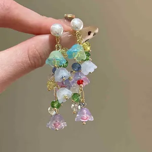 Colorful beaded flower drop earrings with pearl studs for summer vacation style.