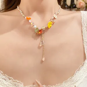 Detailed view of candy-colored beaded necklace with oil-dripped flower charms