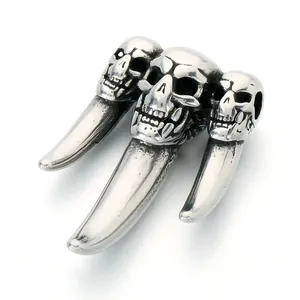 Gothic punk style stainless steel wolf tooth pendant featuring three detailed skulls for men