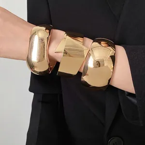 Vintage chunky gold polished metal statement cuffs for women, high-shine fashion jewelry