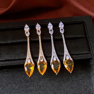 Exquisite vintage 18k gold plated teardrop dangle earrings featuring sparkling yellow zircons