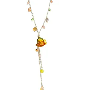 Elegant preserved orange rose lariat necklace featuring multi-colored beads and tassels