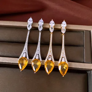 Elegant 18k gold plated long drop earrings with pear-cut yellow zircons and pavé detail