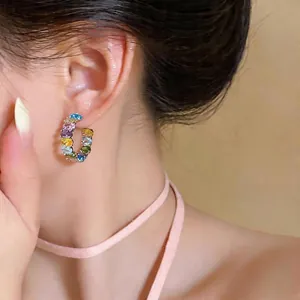 Elegant multi-color C-shaped hoop earrings with oval zircon stones on silver needles