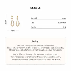 Close-up detail showing dimensions and material of irregular hollow resin earrings.