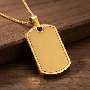 Close-up of a brushed gold stainless steel military dog tag pendant necklace detail