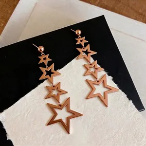 Elegant rose gold stainless steel dangling star earrings with hollow design