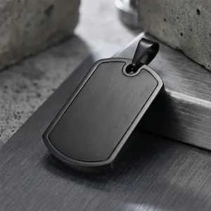 Detailed macro view of a black brushed stainless steel dog tag pendant necklace