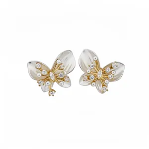 Elegant gold butterfly stud earrings with pearls and cubic zirconia on white background.