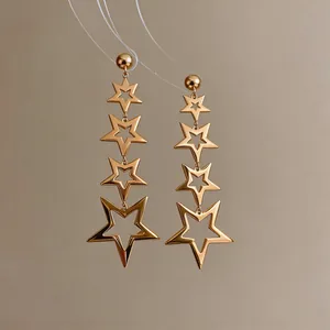 Elegant gold plated stainless steel star drop earrings featuring multiple hollow stars