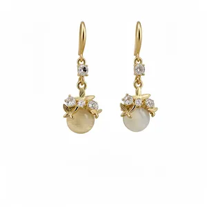 Elegant gold-toned drop earrings with cat-eye stone and sparkling rhinestones for women