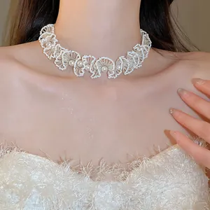 Close-up of elegant French style beaded pearl choker necklace on a model's neck