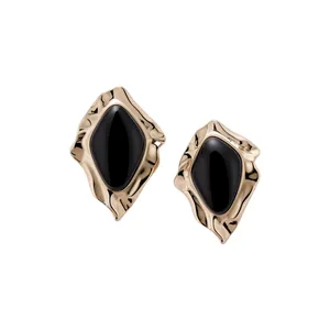 Exquisite gold irregular stud earrings with black enamel center and unique wavy edges