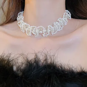 Detailed view of an elegant beaded pearl choker necklace with a French luxury design.