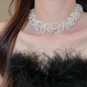 Elegant detail shot of a luxury French-style pearl beaded choker necklace worn by a model