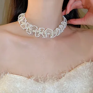 Close-up of elegant French style beaded pearl choker necklace on model's neck