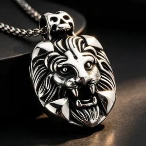 Detailed macro view of a men's vintage stainless steel lion head pendant with skull bail.