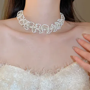 Elegant French style white beaded pearl choker necklace worn by a professional model