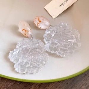 Elegant resin flower drop earrings with oval studs and silver needles in a soft style