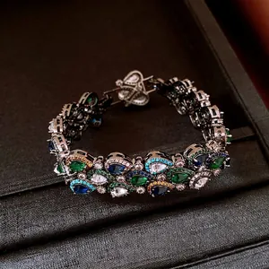 Bracelet vintage de style palais plaqué or avec des pierres précieuses colorées en goutte