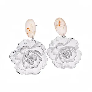 Elegant silver needle resin flower earrings with oval gold foil pendants on white background