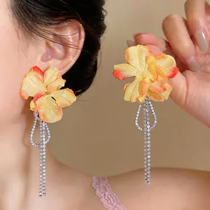 Elegant fabric flower earrings with long sparkling rhinestone tassels for vacation
