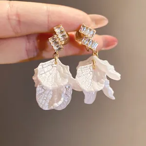 Elegant zircon stud earrings with layered white petal drops, perfect for summer holiday style