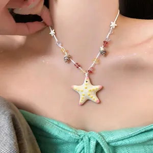 Handmade ceramic starfish necklace with colorful beads for summer vacation beach look