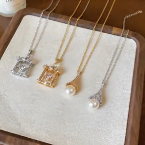 Detailed view of elegant pearl and zircon heart pendant necklaces in gold and silver.