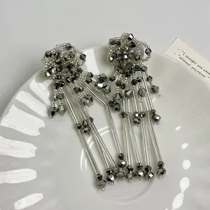 Handmade elegant silver needle flower tassel earrings featuring shimmering grey faceted beads