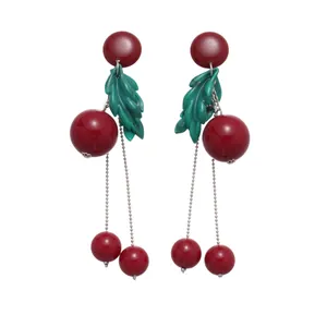Elegant red resin cherry drop earrings with green leaves and long silver tassel chains