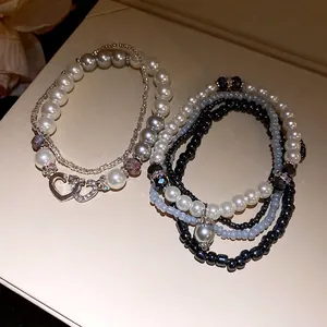 Set di bracciali di perle bohémien multistrato con perle sintetiche e ciondolo a cuore