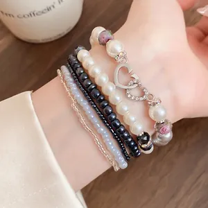 Elegante set di bracciali di perle multistrato in stile bohémien con ciondoli a cuore