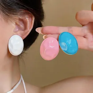 Oversized acrylic oval stud earrings in vibrant macaron colors with hammered texture
