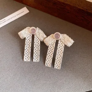 Elegant silver bow lace earrings with lavender stone for women