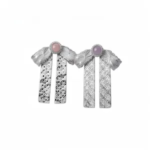 Elegant silver bow-knot drop earrings featuring pink and purple central gemstones