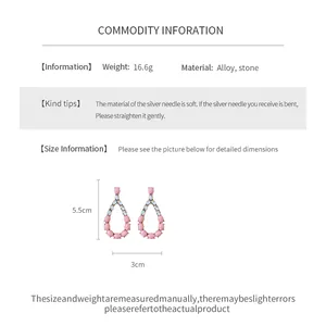 Macro detail of vintage pink teardrop earrings with dimensions 5.5cm and material specs