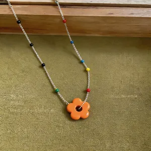 Detailed macro view of a summer dopamine flower beaded necklace with vibrant colorful beads