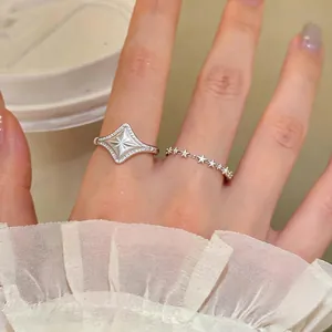 Elegant silver starburst and small star ring set for women with unique French style design