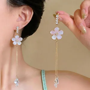French light luxury long tassel earrings featuring pink enamel flower pendants for women